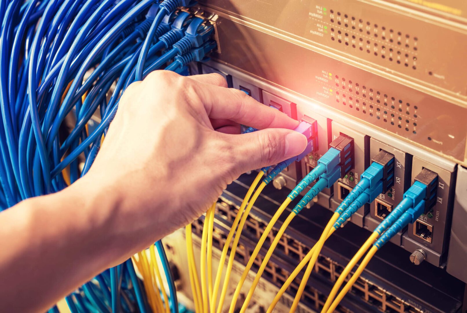 A person is touching the wires on a rack.